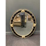 A pair of modern Christopher Guy oval wall mirrors, 101 x 95cm
