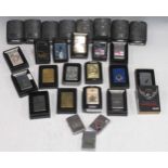 A collection of twenty-seven Zippo lighters, including various Royal Navy/Royal Air Force and some