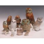 Three Karl Ens porcelain owls, a Zsolnay Pecs owl seated upon a book with quill, a Royal