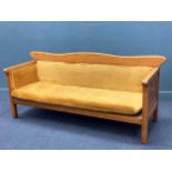 A large Arts & Crafts style upholstered oak settle, 90 x 209 x 68cm