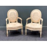 A pair of French late 19th century painted frame open armchairs in 18th century style with padded