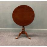 A George III mahogany circular tripod table,75 x 70cm