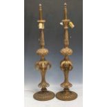 A pair of gilt metal lamps in the Belle Epoque style 90cm high (2)