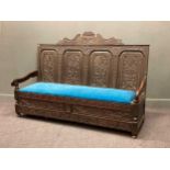 A Victorian 17th century style carved oak settle128 x 185 x 70cm