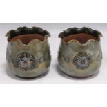 A pair of Royal Doulton stoneware miniature jardinieres with scalloped rims, the light green