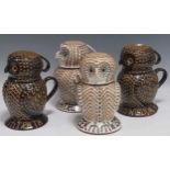 Four Alsagar Pottery slipware lidded owl jugs, 21cm high (4)Nibble chips to the base and lip rim,