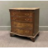 A small George III style mahogany serpentine chest of drawers, the moulded top over a brushing slide
