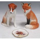 A Royal Worcester model of a seated fox 2993 19cm high and hound 18cm high and a Mintons
