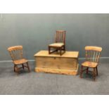 A stripped pine blanket chest 44 x 102 x 47cm and three vintage child's chairs (4)