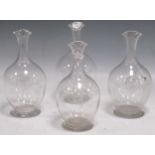 Four glass decanters with the coat of arms of the Barlow family, 20cm high (4)All four crests the