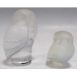 A Lalique pearlescent glass owl and a Lalique clear and frosted glass owl, 6cm and 9cm high Minor