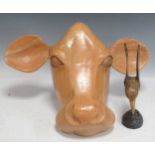 A carved head of a cow 26 x 48 x 24cm; together with a carved hummingbird 22cm high, each signed