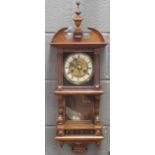 An Austrian walnut clock with two-piece dial and white chapter ring, circa 1900, 62 x 27 x 16cm