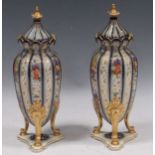 A pair of late 19th century German porcelain lidded vases, Volkstedt region, marked RW in sigil to