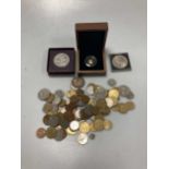 A proof issue quarter sovereign cased by the Royal Mint, together with an assortment of coins
