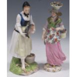 A German porcelain figure of a lady with a basket of flowers, 23cm high, and another Continental