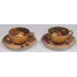 Two Royal Worcester small tea cups and saucers, painted with fruit by W. H. Austin and E. Townsend