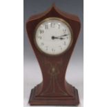 An Art Nouveau period mahogany mantel timepiece, lancet shape case, balance wheel movement, ribbon