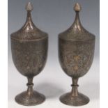 A pair of Indian Mughal-style inlaid metal cups and covers, early 20th century, 21cm high Cover rims
