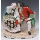 A large Sampson porcelain figure group, after Derby, modelled as a seated courting couple, 25cm