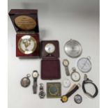 A collection of wrist watches, pocket watches and barometers