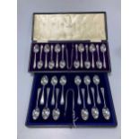 2 cased sets each of 12 silver teaspoons with sugar nips, together with a cased set of 6 silver