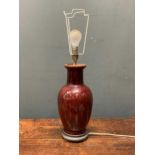 A sang de boeuf type glazed ceramic lamp base, 63cm high including fittings