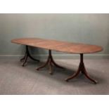 A Regency style mahogany triple pedestal dining table, with two additional leaves, 76 x 306 x