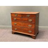 A George III oak chest of drawers with oval brass handles, 87 x 98 x 51cm