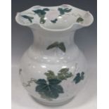 A Chinese liling porcelain floral vase, 28cm high, and an Indian carved horn horse car bonnet mascot