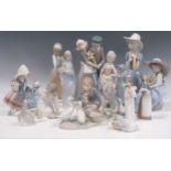 A collection of twelve Lladro figures, two Nao examples and another similar, tallest 30cm high (15)