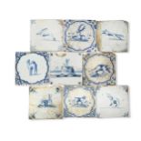 A collection of twenty-two Delft blue and white tiles, 18th century,