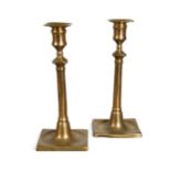 A pair of brass candlesticks, 18th century,