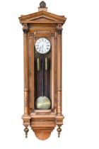 An impressive Vienna figured walnut chiming wall clock,