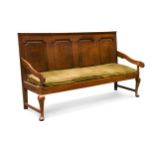 A George III oak panel back settle,