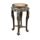 An oriental carved and pierced hardwood stand with marble top, circa 1900,