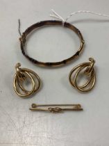 A hallmarked 9ct gold Infinity brooch, a pair of earrings tested as 9ct gold and a hallmarked 9ct