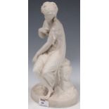 A Copeland bisque female statuette with a bird on a naturalistic base, 34cm high
