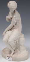 A Copeland bisque female statuette with a bird on a naturalistic base, 34cm high