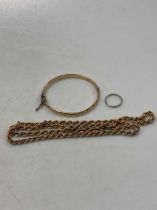 A hallmarked 9ct gold rope chain weight 16.2g, together with a bangle stamped '1/5TH 9CT BRONZE