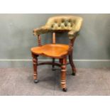 A late Victorian horseshoe shaped desk chair stamped 'MAPLE & CO' 89 x 60 x 70cm and an early 20th