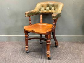 A late Victorian horseshoe shaped desk chair stamped 'MAPLE & CO' 89 x 60 x 70cm and an early 20th