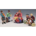 A group of Royal Doulton figurines, Boy Evacuee, Girl Evacuee, Welcome Home, The Homecoming and