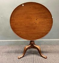 A George III mahogany tripod table, 80cm diameter and another smaller tripod table 51cm diameter (