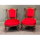 A pair of late Victorian red upholstered small nursing chairs (2)