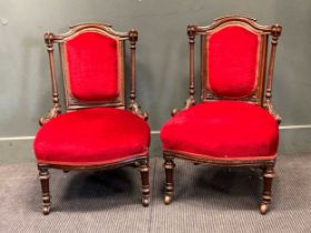 A pair of late Victorian red upholstered small nursing chairs (2)