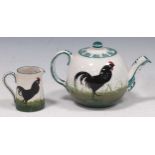 Small Wemyss teapot and jug, painted with black cockerels, teapot 12cm high
