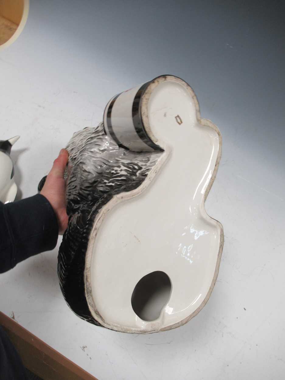 A Beswick Dulux advertising Old English Sheepdog with paint tin