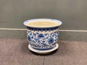 A Chinese blue and white jardiniere and circular tray, total 32cm high and 41cm diameter