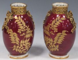 A pair of Granger and co Worcester decorated vases, 21cm high